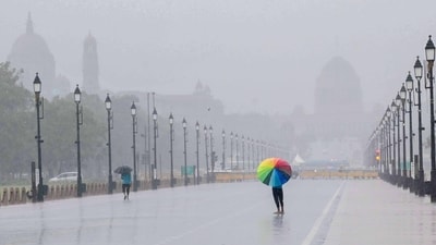 People enjoy during a rain at the Kartavya Path in New Delhi (Photo by Arvind Yadav/ Hindustan Times) (Hindustan Times) People enjoy during a rain at the Kartavya Path in New Delhi (Photo by Arvind Yadav/ Hindustan Times) (Hindustan Times)