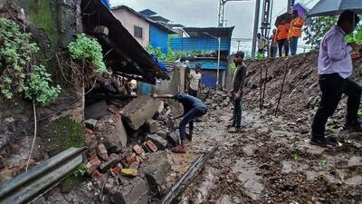 Thane, India - June 28, 2024: Due to heavy rain in Thane, a 20 feet high and 60 feet long Railway boundary wall collapsed near platform no 2 of Thane railway station and 2 people were injured. and damaging a house Railway workers are seen clearing the debris , in Thane,in Mumbai, India, on, Friday, June 28, 2024. ( Praful Gangurde / HT Photo ) Thane, India - June 28, 2024: Due to heavy rain in Thane, a 20 feet high and 60 feet long Railway boundary wall collapsed near platform no 2 of Thane railway station and 2 people were injured. and damaging a house Railway workers are seen clearing the debris , in Thane,in Mumbai, India, on, Friday, June 28, 2024. ( Praful Gangurde / HT Photo )