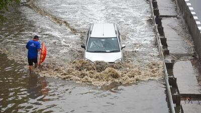 Vehicles wade through a waterlogged stretch during rain on the NH-48 service road near Narsinghpur village foot-over-bridge, in Gurugram on June 28. (Parveen Kumar/HT) Vehicles wade through a waterlogged stretch during rain on the NH-48 service road near Narsinghpur village foot-over-bridge, in Gurugram on June 28. (Parveen Kumar/HT)