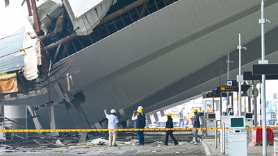 Rescue operations are in progress after a portion of the roof at Delhi Airport's Terminal 1 collapsed early this morning due to heavy rain, in New Delhi (Vipin Kumar/ Hindustan Times) Rescue operations are in progress after a portion of the roof at Delhi Airport's Terminal 1 collapsed early this morning due to heavy rain, in New Delhi (Vipin Kumar/ Hindustan Times)