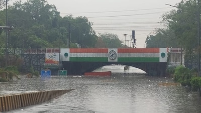 Delhi rain: A vehicle partially submerged in the waterlogged underpass at Minto bridge. Delhi rain: A vehicle partially submerged in the waterlogged underpass at Minto bridge.
