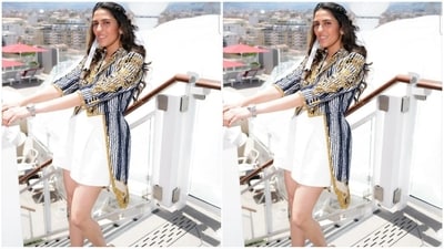 In another stunning look, she radiated trendiness in a blue and white striped jacket with an uneven hemline and intricate golden detailing. She perfectly paired it with white high-waisted shorts. (Instagram/@ambani_update) In another stunning look, she radiated trendiness in a blue and white striped jacket with an uneven hemline and intricate golden detailing. She perfectly paired it with white high-waisted shorts. (Instagram/@ambani_update)