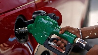 A worker holds a nozzle to pump petrol into a vehicle at a fuel station in Mumbai. (Reuters/File) A worker holds a nozzle to pump petrol into a vehicle at a fuel station in Mumbai. (Reuters/File)