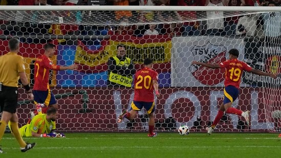 Spain celebrate after Italy's own goal. (AP)