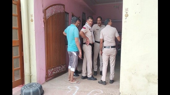 Police at the crime spot in Charkhi Dadri’s Ghasola village in Haryana on Friday morning. (HT Photo)