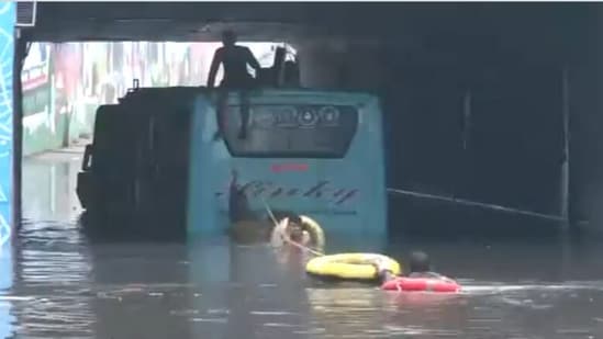 A video shared by news agency ANI showed the passengers being rescued from the bus on Friday. (ANI)