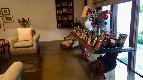 Water from a flooded road entered a house in Maharani Bagh, damaging furniture. (HT Photo)