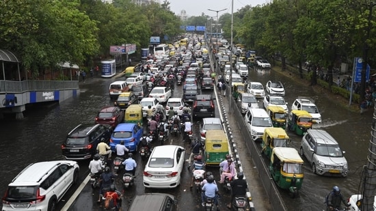 According to officials, major areas in the national capital such as Narsinghpur Chowk, Hero Honda Chowk, Rajiv Chowk, Vatika Chowk, Iffco Chowk, Dwarka Expressway, Golf Course Extension Road, Southern Peripheral Road, Udyog Vihar, Sohna Road, Basai, Khandsa Road, and Pataudi Road were waterlogged along with several internal roads.(Sanjeev Verma/Hindustan Times)