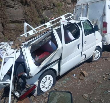 A parked vehicle that was damaged after heavy overnight rain led to a landslide in Shimla on Friday. (Deepak Sansta/HT)