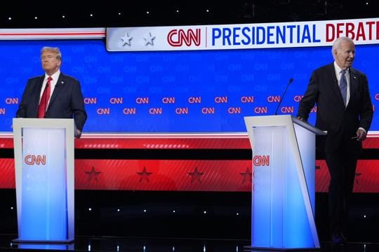 President Joe Biden, right, walks off stage as Republican presidential candidate former President Donald Trump stands at the conclusion of a presidential debate (AP) President Joe Biden, right, walks off stage as Republican presidential candidate former President Donald Trump stands at the conclusion of a presidential debate (AP)