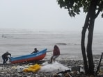 Fishermen pulling their boats ashore. (Representative image) Fishermen pulling their boats ashore. (Representative image)