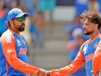 India's Rohit Sharma (c) and Kuldeep Yadav celebrate the dismissal of Australia's Glenn Maxwell during their Super 8 Group 1 match in the ICC Mens T20 World Cup 2024
India's Rohit Sharma (c) and Kuldeep Yadav celebrate the dismissal of Australia's Glenn Maxwell during their Super 8 Group 1 match in the ICC Mens T20 World Cup 2024
