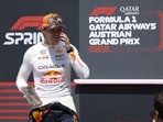 Red Bull Racing's Dutch driver Max Verstappen celebrates Red Bull Racing's Dutch driver Max Verstappen celebrates