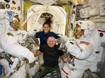 In this photo provided by NASA, Boeing Crew Flight Test astronauts Suni Williams and Butch Wilmore, center, pose with Expedition 71 Flight Engineers Mike Barratt, left, and Tracy Dyson, both NASA astronauts, in their spacesuits aboard the International Space Station's Quest airlock on June 24, 2024. (NASA via AP) In this photo provided by NASA, Boeing Crew Flight Test astronauts Suni Williams and Butch Wilmore, center, pose with Expedition 71 Flight Engineers Mike Barratt, left, and Tracy Dyson, both NASA astronauts, in their spacesuits aboard the International Space Station's Quest airlock on June 24, 2024. (NASA via AP)