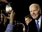 U.S. President Joe Biden poses for a recording as he greets supporters on arrival at Raleigh-Durham International Airport in Raleigh, North Carolina, U.S., after participating in a presidential debate in Atlanta, Georgia, U.S., June 28, 2024. 