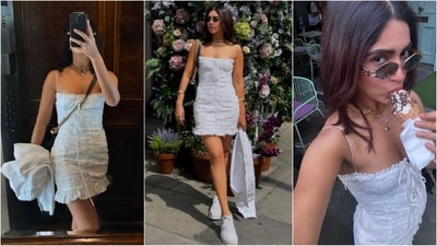 Bhumi Pednekar channels Gen Z vibes in her latest look, sporting a white bodycon dress with tie-on detailing and a ruffle hemline. She completes her ensemble with white sneakers, a stylish black sling bag, stacked chain necklaces and sunglasses. (Instagram) Bhumi Pednekar channels Gen Z vibes in her latest look, sporting a white bodycon dress with tie-on detailing and a ruffle hemline. She completes her ensemble with white sneakers, a stylish black sling bag, stacked chain necklaces and sunglasses. (Instagram)