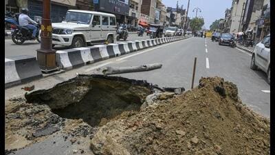 A portion of Rampath caved in following rains, in Ayodhya on June 23. (PTI File) A portion of Rampath caved in following rains, in Ayodhya on June 23. (PTI File)