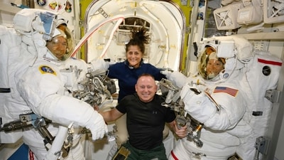 In this photo provided by NASA, Boeing Crew Flight Test astronauts Suni Williams and Butch Wilmore, center, pose with Expedition 71 Flight Engineers Mike Barratt, left, and Tracy Dyson, both NASA astronauts, in their spacesuits aboard the International Space Station's Quest airlock on June 24, 2024. (NASA via AP) (AP) In this photo provided by NASA, Boeing Crew Flight Test astronauts Suni Williams and Butch Wilmore, center, pose with Expedition 71 Flight Engineers Mike Barratt, left, and Tracy Dyson, both NASA astronauts, in their spacesuits aboard the International Space Station's Quest airlock on June 24, 2024. (NASA via AP) (AP)