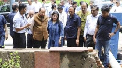 Delhi LG VK Saxena inspects drains that were severely hit by waterlogging following rainfall on Saturday. (PTI) Delhi LG VK Saxena inspects drains that were severely hit by waterlogging following rainfall on Saturday. (PTI)