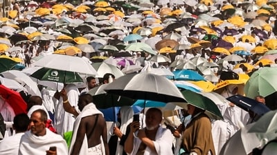 (FILES) Muslim pilgrims use umbrellas to shade themselves from the sun as they arrive at the base of Mount Arafat, also known as Jabal al-Rahma or Mount of Mercy, during the annual hajj pilgrimage on June 15, 2024. Saudi Arabia said on June 23 that more than 1,300 faithful died during the hajj pilgrimage which took place during intense heat, and that most of the deceased did not have official permits. (Photo by Fadel SENNA / AFP) (AFP) (FILES) Muslim pilgrims use umbrellas to shade themselves from the sun as they arrive at the base of Mount Arafat, also known as Jabal al-Rahma or Mount of Mercy, during the annual hajj pilgrimage on June 15, 2024. Saudi Arabia said on June 23 that more than 1,300 faithful died during the hajj pilgrimage which took place during intense heat, and that most of the deceased did not have official permits. (Photo by Fadel SENNA / AFP) (AFP)