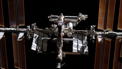 This photo provided by NASA shows the International Space Station from the SpaceX Crew Dragon Endeavour during a fly around of the orbiting lab that took place following its undocking from the Harmony module’s space-facing port, Nov. 8, 2021. NASA has awarded an $843 million contract to SpaceX to build the vehicle that will bring the International Space Station out of its longtime orbit around Earth when its operating lifespan ends in a few more years. (AP) This photo provided by NASA shows the International Space Station from the SpaceX Crew Dragon Endeavour during a fly around of the orbiting lab that took place following its undocking from the Harmony module’s space-facing port, Nov. 8, 2021. NASA has awarded an $843 million contract to SpaceX to build the vehicle that will bring the International Space Station out of its longtime orbit around Earth when its operating lifespan ends in a few more years. (AP)