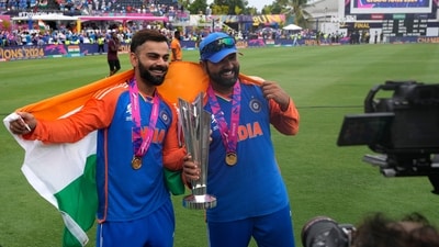 India's Virat Kohli, left, and captain Rohit Sharma pose with the winners trophy after defeating South Africa in the final (PTI) India's Virat Kohli, left, and captain Rohit Sharma pose with the winners trophy after defeating South Africa in the final (PTI)