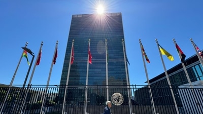 A man walks past the headquarters of the United Nations building in Midtown Manhattan in New York, (AFP)