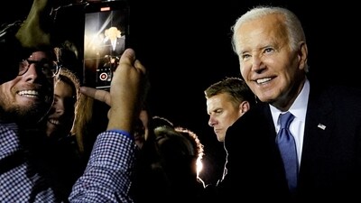 U.S. President Joe Biden poses for a recording as he greets supporters on arrival at Raleigh-Durham International Airport in Raleigh, North Carolina, U.S., after participating in a presidential debate in Atlanta, Georgia, U.S., June 28, 2024. (REUTERS)