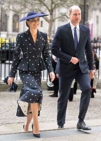 Kate Middleton stuns in a black peplum skirt and blazer adored with white floral prints. (Instagram)