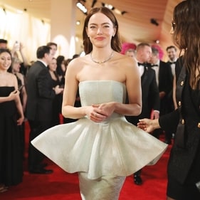Emma Stone stunned in a beige off-shoulder peplum top and matching skirt, accessorised with a diamond necklace at the Oscars 2024. (Pinterest)