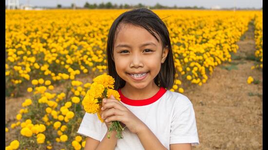 A child’s slightly skewed smile, a slip of tongue, a fumble that makes one feel humble. (Shutterstock)