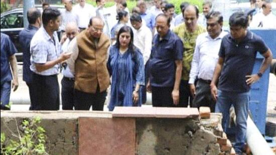 Delhi LG VK Saxena inspects drains that were severely hit by waterlogging following rainfall on Saturday. (PTI)