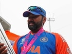 India's captain Rohit Sharma poses for a picture with the trophy after Team India wins the ICC Mens T20 World Cup 2024 India's captain Rohit Sharma poses for a picture with the trophy after Team India wins the ICC Mens T20 World Cup 2024