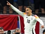 Germany's midfielder Jamal Musiala celebrates scoring.