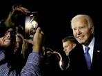 U.S. President Joe Biden poses for a recording as he greets supporters on arrival at Raleigh-Durham International Airport in Raleigh, North Carolina, U.S., after participating in a presidential debate in Atlanta, Georgia, U.S., June 28, 2024. 