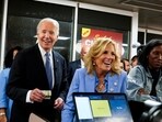 U.S. President Joe Biden and First Lady Jill Biden laugh as they pick up an order from a Waffle House in Marietta, Georgia, after participating in a presidential debate in Atlanta, Georgia, U.S., June 28, 2024. REUTERS/Elizabeth Frantz