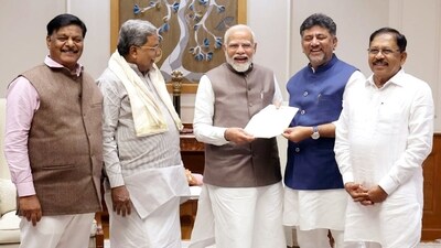 Karnataka Chief Minister Siddaramaiah and Deputy CM DK Shivakumar meet Prime Minister Narendra Modi, in New Delhi on Saturday. (ANI Photo) (CMO Karnataka - X) Karnataka Chief Minister Siddaramaiah and Deputy CM DK Shivakumar meet Prime Minister Narendra Modi, in New Delhi on Saturday. (ANI Photo) (CMO Karnataka - X)