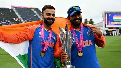 India's Virat Kohli and captain Rohit Sharma celebrate with the trophy after winning the ICC men's Twenty20 World Cup 2024 final (AFP) India's Virat Kohli and captain Rohit Sharma celebrate with the trophy after winning the ICC men's Twenty20 World Cup 2024 final (AFP)