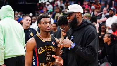 (FILES) Bronny James #6 of the West team talks to Lebron James of the Los Angeles Lakers after the 2023 McDonald's High School Boys All-American Game at Toyota Center on March 28, 2023 in Houston, Texas. Bronny James, the 19-year-old son of Los Angeles Lakers superstar LeBron James, was selected 55th overall by the Los Angeles Lakers in June 27's second round of the NBA Draft. (AFP) (FILES) Bronny James #6 of the West team talks to Lebron James of the Los Angeles Lakers after the 2023 McDonald's High School Boys All-American Game at Toyota Center on March 28, 2023 in Houston, Texas. Bronny James, the 19-year-old son of Los Angeles Lakers superstar LeBron James, was selected 55th overall by the Los Angeles Lakers in June 27's second round of the NBA Draft. (AFP)