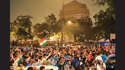 Fans celebrate on a road near the India Gate early on Sunday. (Arvind Yadav/HT Photo) Fans celebrate on a road near the India Gate early on Sunday. (Arvind Yadav/HT Photo)