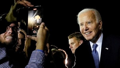 U.S. President Joe Biden poses for a recording as he greets supporters on arrival at Raleigh-Durham International Airport in Raleigh, North Carolina, U.S., after participating in a presidential debate in Atlanta, Georgia, U.S., June 28, 2024. (REUTERS)