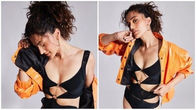 Taapsee Pannu gives swimsuits a trendy twist by wearing a chic black monokini with stylish cut-outs and paired it with a shiny orange jacket. (Instagram) Taapsee Pannu gives swimsuits a trendy twist by wearing a chic black monokini with stylish cut-outs and paired it with a shiny orange jacket. (Instagram)