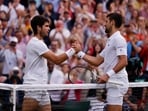 Spain's Carlos Alcaraz (Left) with Serbia's Novak Djokovic after winning the Wimbledon final.