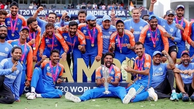 India's players pose for a group picture with the trophy as they celebrate after beating South Africa by 7 runs in the ICC Mens T20 World Cup 2024 final match, at Kensington Oval in Barbados on Saturday (ICC- X) India's players pose for a group picture with the trophy as they celebrate after beating South Africa by 7 runs in the ICC Mens T20 World Cup 2024 final match, at Kensington Oval in Barbados on Saturday (ICC- X)