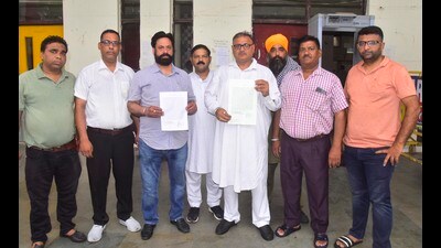 Activists on Monday with a copy of the memorandum before submitting to the district administration, highlighting the shortage of resources at civil hospital in Ludhiana. (Gurpreet Singh/HT) Activists on Monday with a copy of the memorandum before submitting to the district administration, highlighting the shortage of resources at civil hospital in Ludhiana. (Gurpreet Singh/HT)