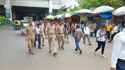 Ajay Kumar, additional deputy commissioner of police, traffic, along with JN Asthana, assistant commissioner of police, traffic, Central, near Charbagh railway station on Monday (HT Photo)