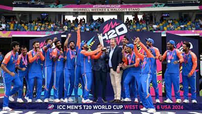 Barbados, Jun 30 (ANI): BCCI Secretary Jay Shah hands over the ICC Mens T20 World Cup 2024 trophy to India's captain Rohit Sharma after they beat South Africa by 7 runs in the final match, at Kensington Oval in Barbados on Saturday. (ANI Photo) (BCCI-X) Barbados, Jun 30 (ANI): BCCI Secretary Jay Shah hands over the ICC Mens T20 World Cup 2024 trophy to India's captain Rohit Sharma after they beat South Africa by 7 runs in the final match, at Kensington Oval in Barbados on Saturday. (ANI Photo) (BCCI-X)