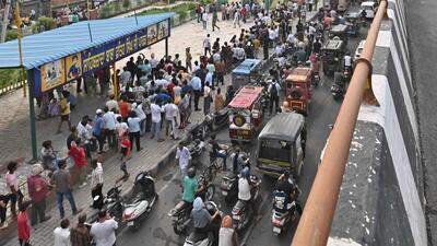 Crowd gathered near the spot where the woman and son climbed atop an overhead tank in Ludhiana on Monday. (Gurpreet Singh/HT) Crowd gathered near the spot where the woman and son climbed atop an overhead tank in Ludhiana on Monday. (Gurpreet Singh/HT)