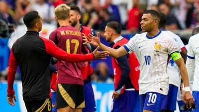 France's Kylian Mbappe, right, is greeted by Belgium's Youri Tielemans at the end of a round of sixteen match between France and Belgium at the Euro 2024 (AP) France's Kylian Mbappe, right, is greeted by Belgium's Youri Tielemans at the end of a round of sixteen match between France and Belgium at the Euro 2024 (AP)