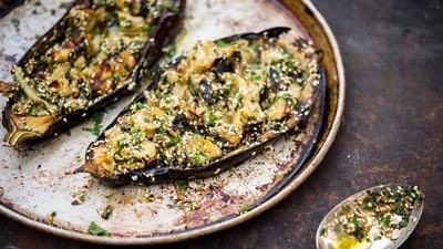 This image released by Milk Street shows a recipe for grilled eggplant with sesame and herbs. (AP) This image released by Milk Street shows a recipe for grilled eggplant with sesame and herbs. (AP)